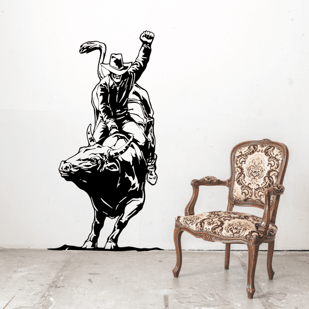 Furniture complemented by a wall sticker of a cowboy bull riding