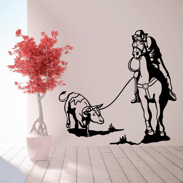 Wall decal illustrating a cowboy on horseback roping a steer