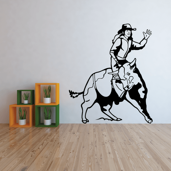 Wall embellishment featuring a bull-riding cowgirl waving greeting at a rodeo