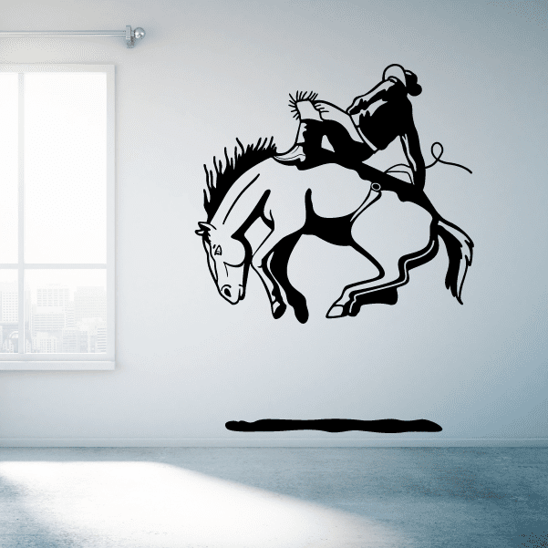 Decorative wall graphic of a horse-riding cowboy in a rodeo scene