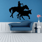 Interior design with a rodeo-inspired wall sticker above a blue sofa