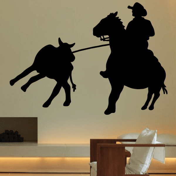 Cowboy and bull confrontation captured in a wall decal design