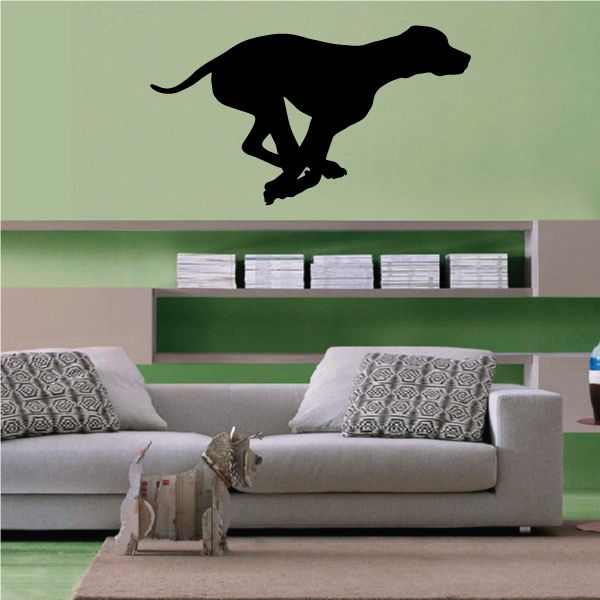 Black running hound dog silhouette decal with arched tail and forward paws