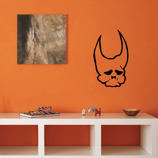 Horned skull decal with sad face, black outline and horns
