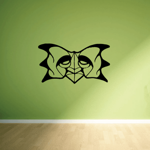 Stylized black mask decal with skeletal eyes and winged design