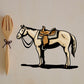 Horse sticker with saddle, cream body and brown tack, black outline, side profile