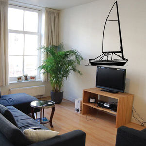 Large sailboat wall decal with black outline on a light-colored wall
