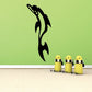 Leaping dolphin tribal decal in black, curved fin and tail silhouette