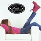 Black oval Santa Define Good wall decal with white cursive lettering