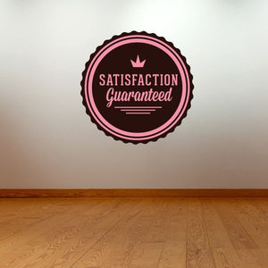 Round vinyl badge wall decal: pink border, crown, SATISFACTION Guaranteed lettering