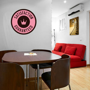 Vinyl wall decal badge reading "SATISFACTION GUARANTEED" with crown icon