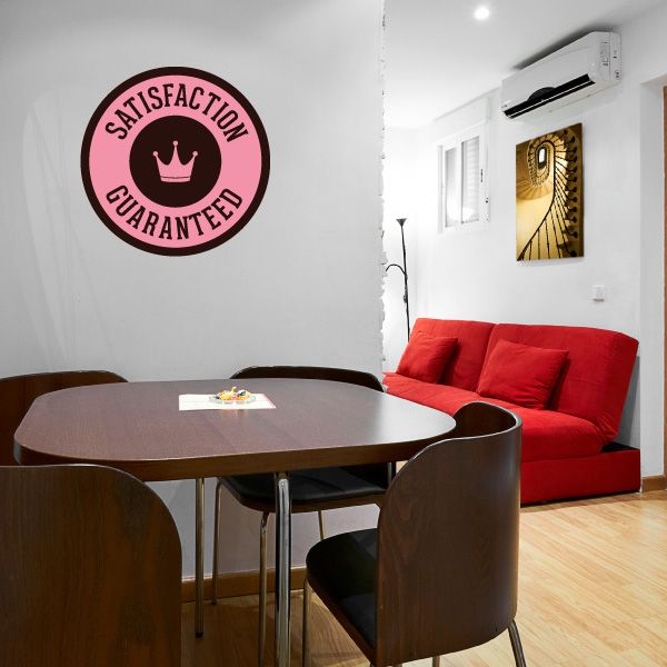 Vinyl wall decal badge reading "SATISFACTION GUARANTEED" with crown icon