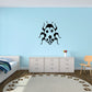 Ladybug wall decal, black-and-white bug with big eyes and spotted wings.