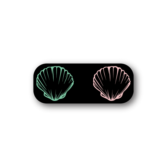 Sea shell bra vinyl sticker: black oval with teal and pink shell graphics.