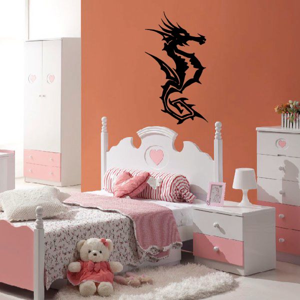 Tribal seahorse wall decal in black, centered above bed headboard
