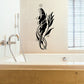 Black whale and seaweed wall decal with swirling fins and small bubbles