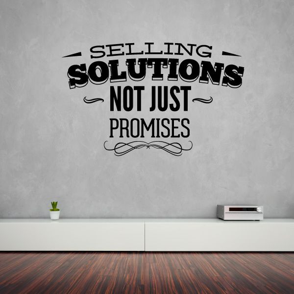 Vinyl wall decal with text: 'Selling Solutions, Not Just Promises'.