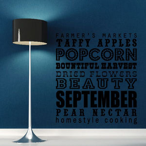 September word collage wall decal with layered typography lettering, dark and patterned.