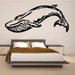 Whale wall decal in black with an arched, flowing design
