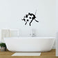 Ladybug wall decal, black-and-white cartoon bug with antennae and spots.