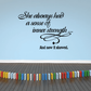 Wall decal with black cursive quote: 'She always had a sense of inner strength'