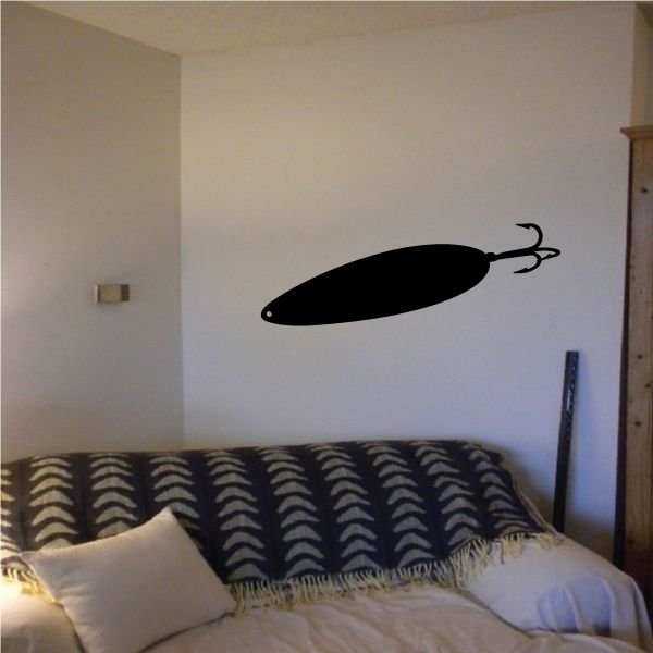 Fishing lure decal with black oval body and treble hook detail