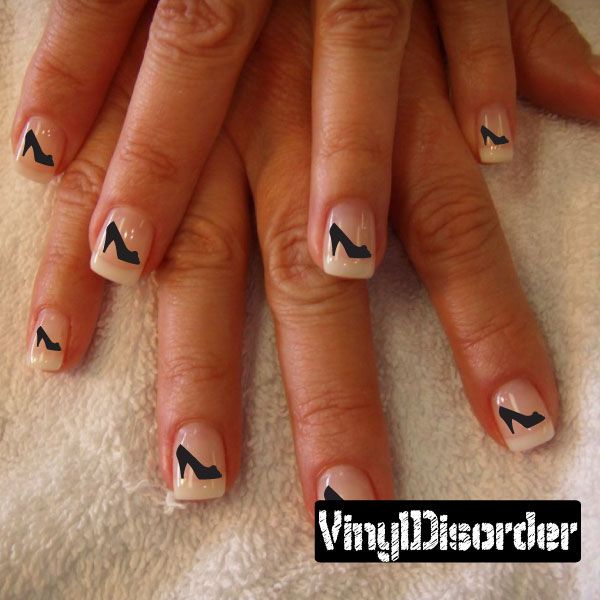 Vinyl nail art stickers with black shoe icons on nude nails