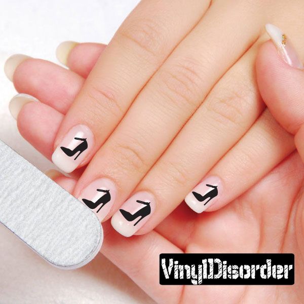 Vinyl nail art stickers with black shoe icons on white nails
