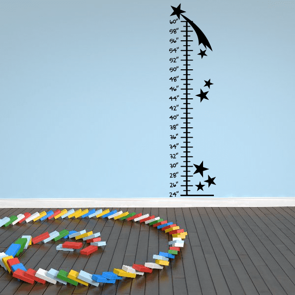 Growth chart wall decal with black rocket, stars, and inch ruler markings