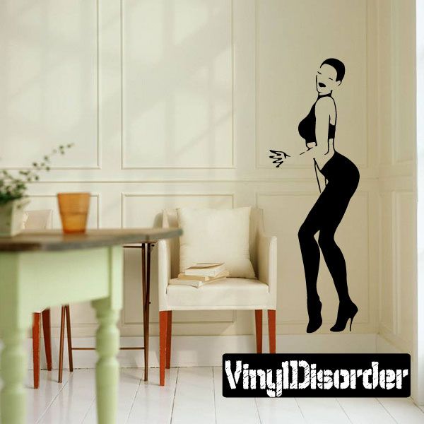 Wall decal of woman silhouette in black heels and tight pants