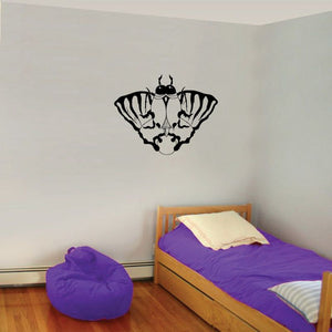 Black winged moth wall decal with white wing markings.