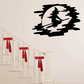 Black riding witch decal within a pale moon, with trailing broom-like silhouette
