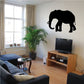 Black elephant silhouette wall decal, shuffling pose.