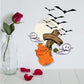 Printed die-cut wall decal with orange ghost, pumpkin, and black bats