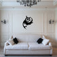 Black owl decal with side wings on wall