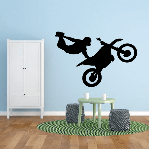 Black silhouette dirt bike decal with rider in foot-grab pose