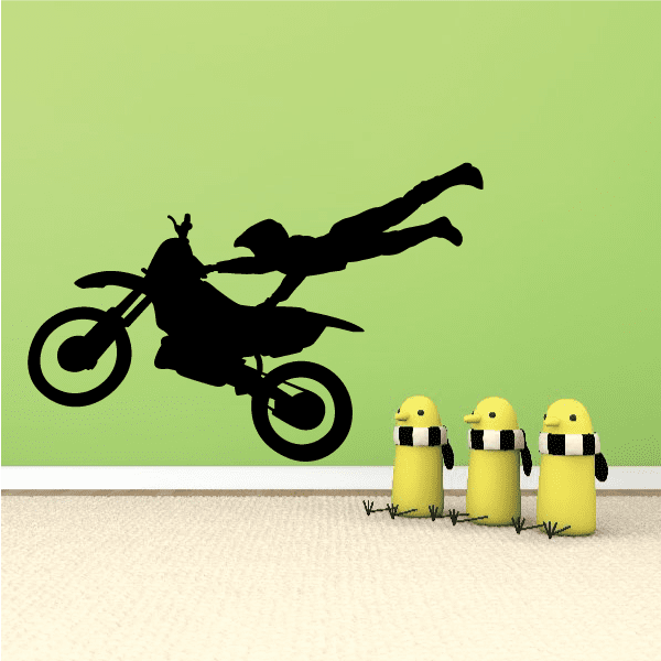 Black dirt bike decal silhouette on a green background
