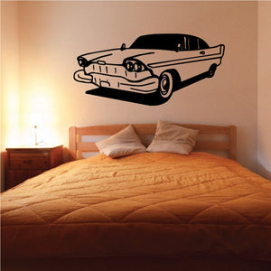 Classic car decal in black and gray, side profile with wheels and grille outline.