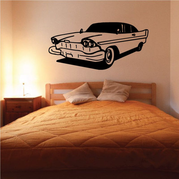 Classic car decal in black and gray, side profile with wheels and grille outline.