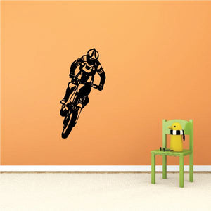 Dirt bike decal with motocross rider silhouette, black with orange accents