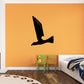 Black hawk swooping wall decal with curved wings and outstretched talons