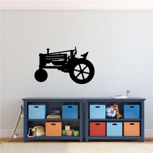 Tractor decal with simple black tractor silhouette and large spoked wheel