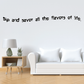 Wall decal with black quote: 'Sip and savor all the flavors of life.'