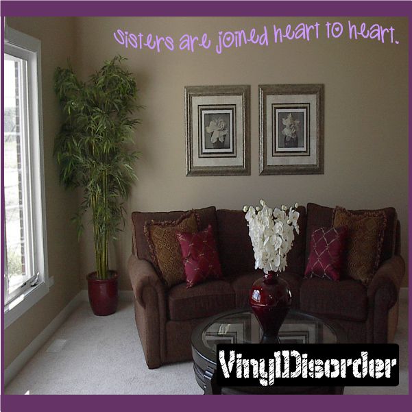 Sisters are joined heart to heart wall decal, purple lettering on wall.
