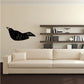 Sitting crow wall decal, black bird silhouette with white speckles and beak.