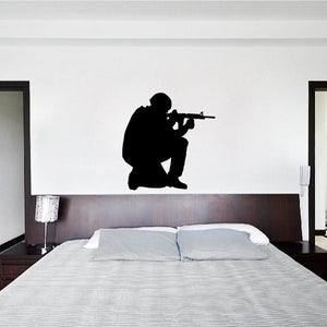 Sitting soldier aiming wall decal, black silhouette