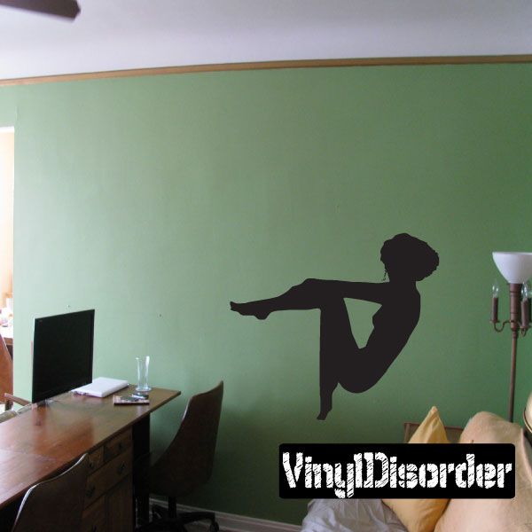 Leaning-back seated woman silhouette wall decal, black.