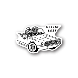 Skeleton vinyl sticker with two skulls in a car, 'GETTING LOST' text