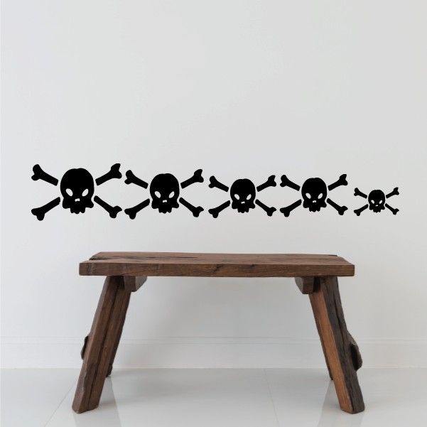 Skull-and-crossbones wall decal with repeating skull icons, black.