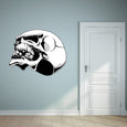 Skull-themed wall sticker positioned near a room's entrance door